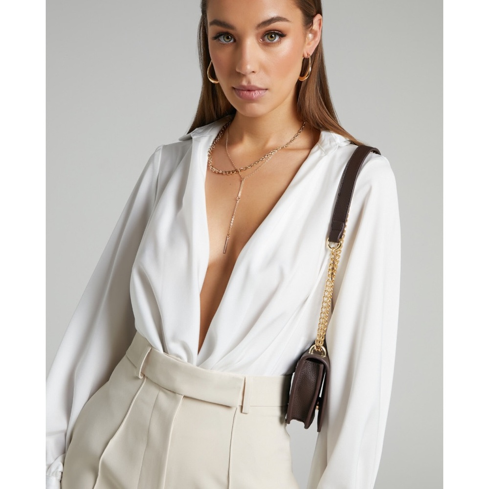 White plunge neck body suit